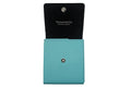 Tiffany & Co. turquoise leather wallet with black interior on a light gray background