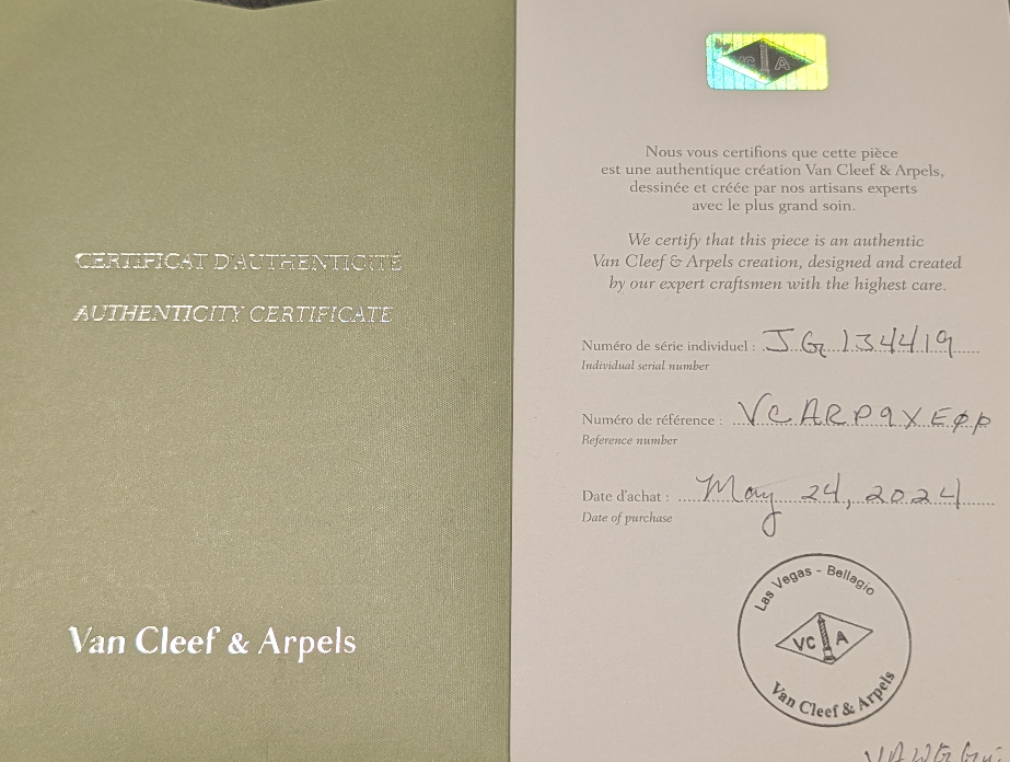 Van Cleef & Arpels authenticity certificate on a beige background